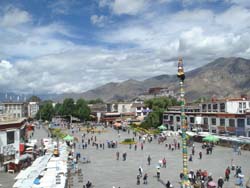 View of the Borkhar Square and Himalayan Mountains seen from the top of the Jokhang temple