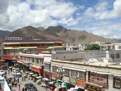 View of the market and Himalayan Mountains seen from the Jokhang temple