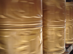 Spinning prayer wheels along an aisle way inside the Jokhang Temple