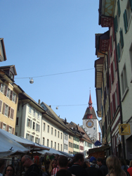 Tower at the entrance to Bremgarten Old Town and the Easter Market in the foreground