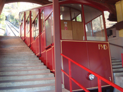 The bright red funicular heading up to the summit of Monte Bre from Suvigliana in Lugano, Ticino