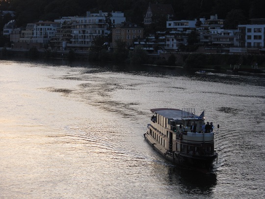 Heidelberg - a ship sailing the river at sunset
